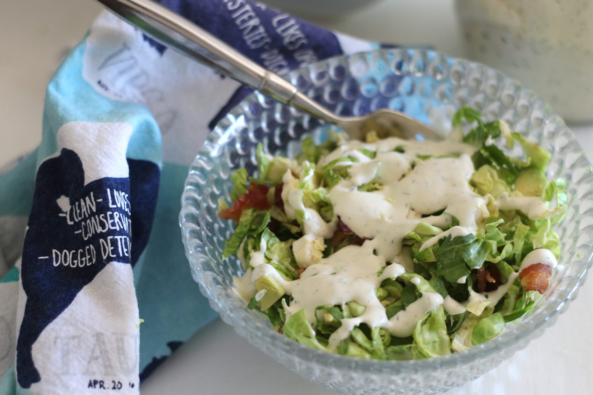 Brussels sprouts, avocado and bacon salad with creamy dill dressing