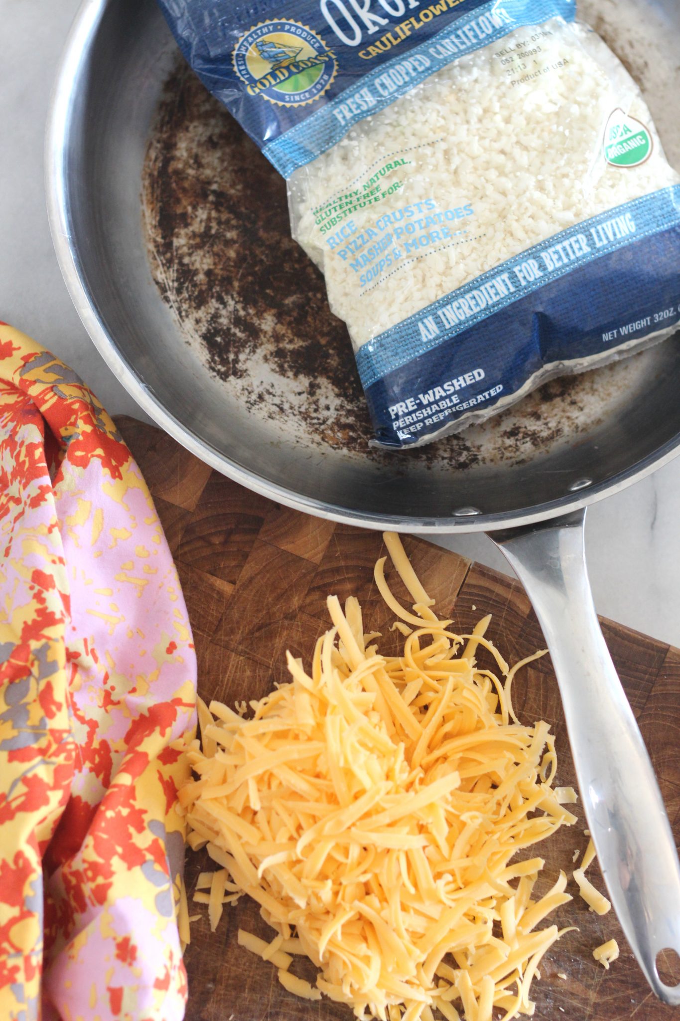 Cheddar Cauliflower Rice is a quick side dish that tastes great and is perfect for a weeknight. With only 2.2 net carbs per serving, it is great for keto and low carb diets.