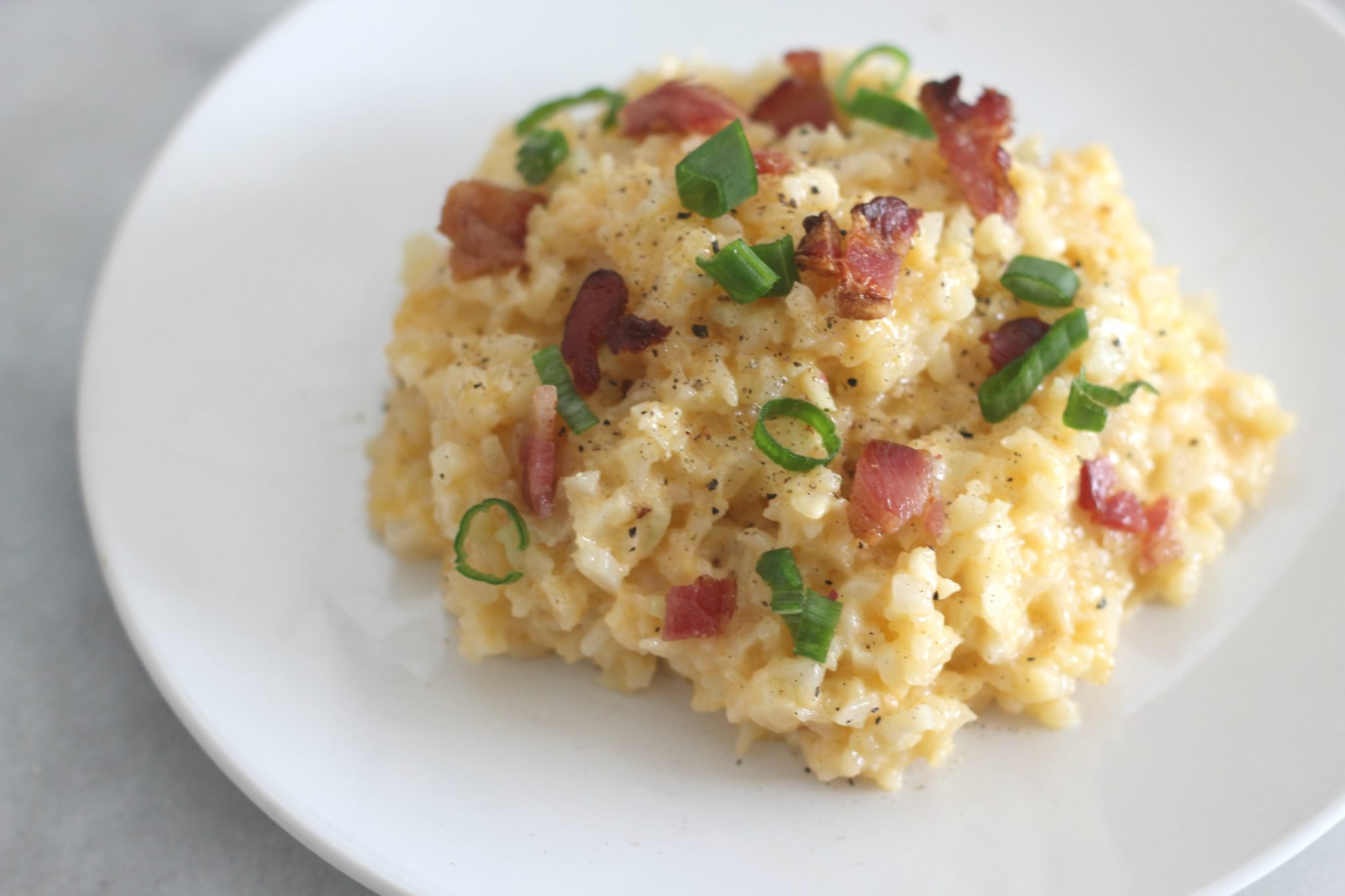 Cheddar Cauliflower Rice is a quick side dish that tastes great and is perfect for a weeknight. With only 2.2 net carbs per serving, it is great for keto and low carb diets.