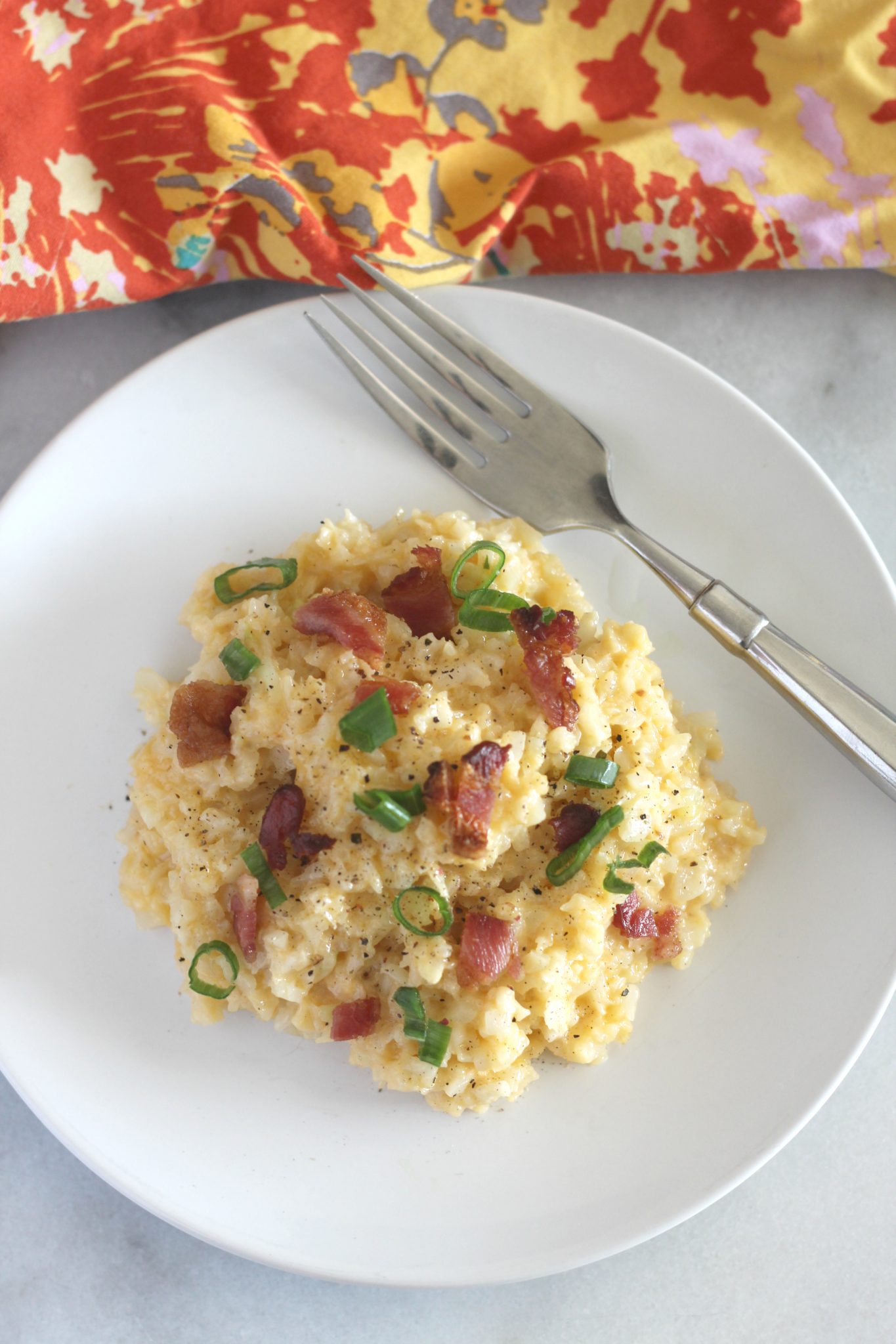 Cheddar Cauliflower Rice is a quick side dish that tastes great and is perfect for a weeknight. With only 2.2 net carbs per serving, it is great for keto and low carb diets.