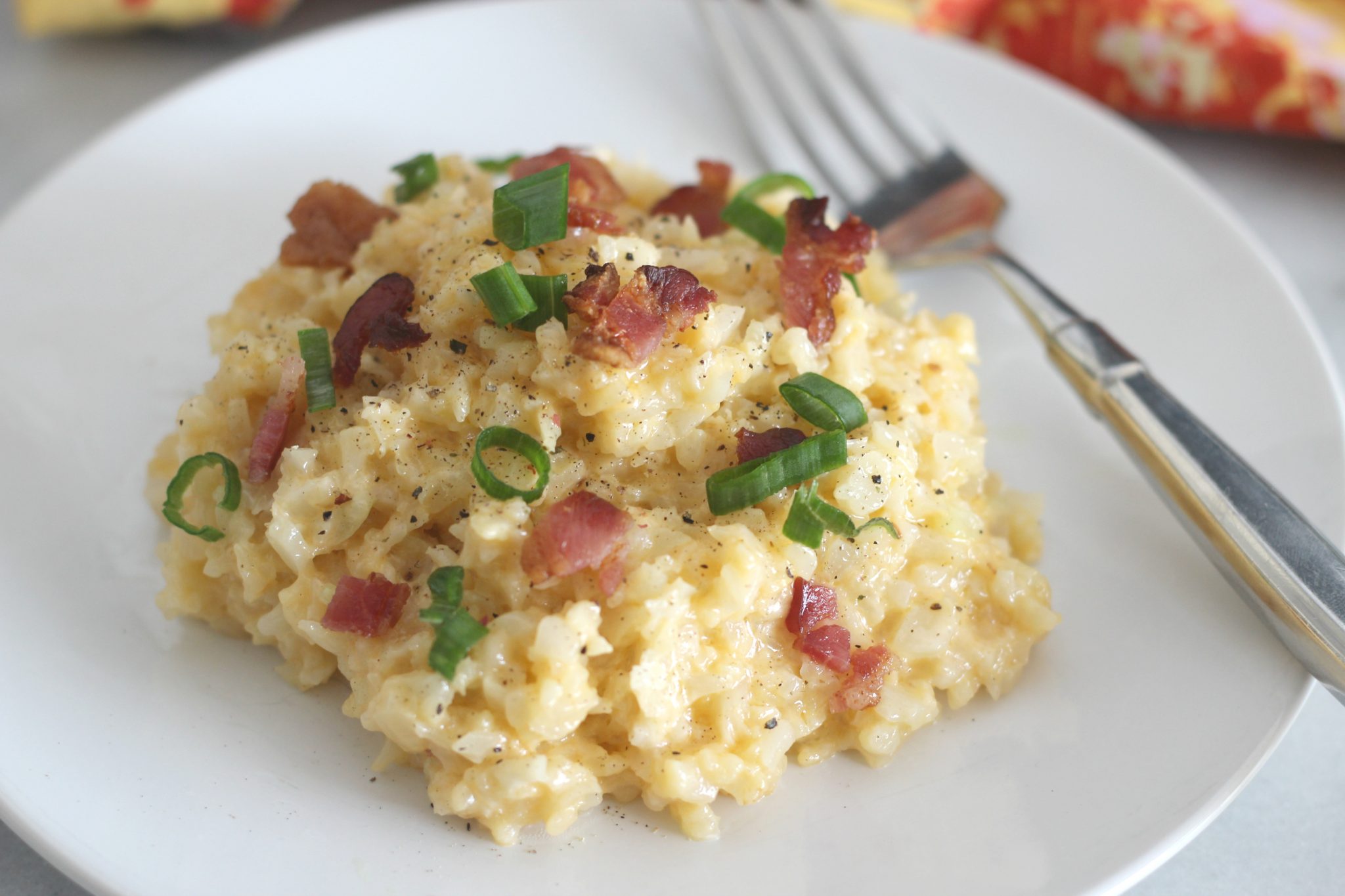 Cheddar Cauliflower Rice is a quick side dish that tastes great and is perfect for a weeknight. With only 2.2 net carbs per serving, it is great for keto and low carb diets.