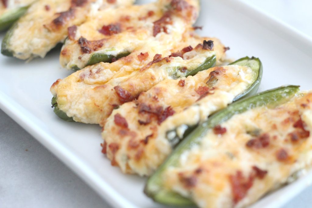 You are going to love this recipe for roasted chicken and bacon jalapeño poppers! These are perfect low carb/keto appetizers and they taste amazing. #lowcarbrecipes #chicken #jalapenopoppers #ketorecipes