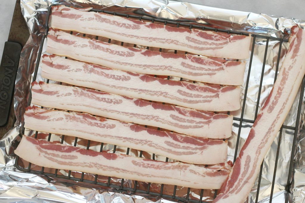 Once you use this method to bake your bacon, you'll never prepare it another way again! Easy perfect oven baked bacon! #cookingbasics #bacon #lowcarb #keto
