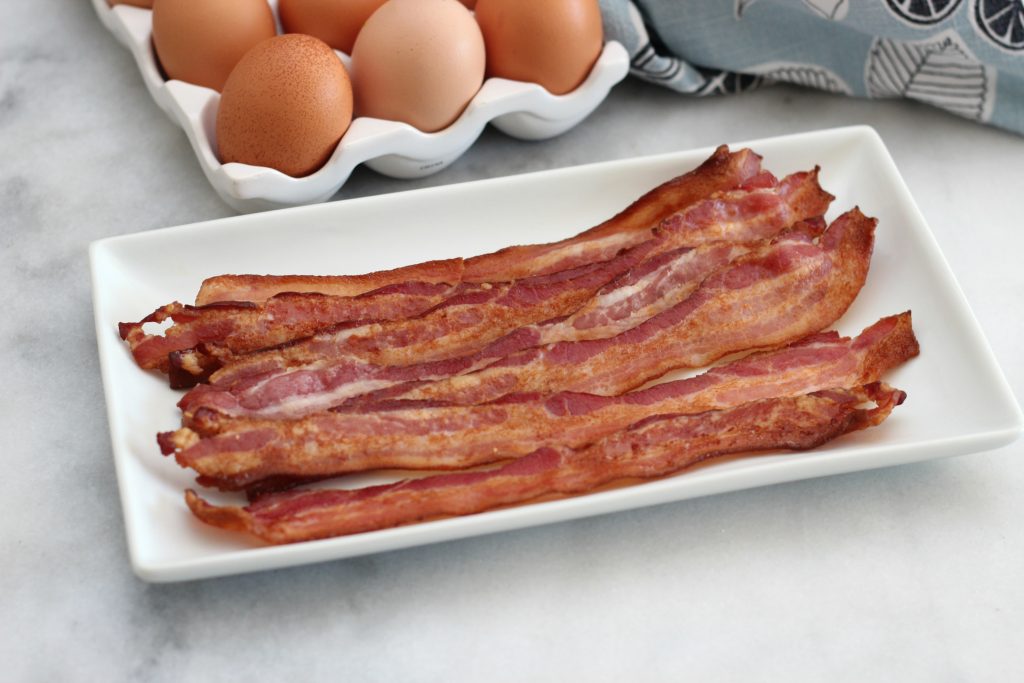 Once you use this method to bake your bacon, you'll never prepare it another way again! Easy perfect oven baked bacon! #cookingbasics #bacon #lowcarb #keto