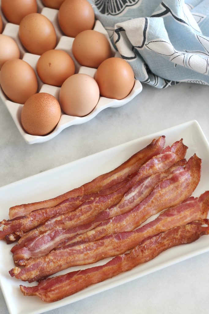 Once you use this method to bake your bacon, you'll never prepare it another way again! Easy perfect oven baked bacon! #cookingbasics #bacon #lowcarb #keto
