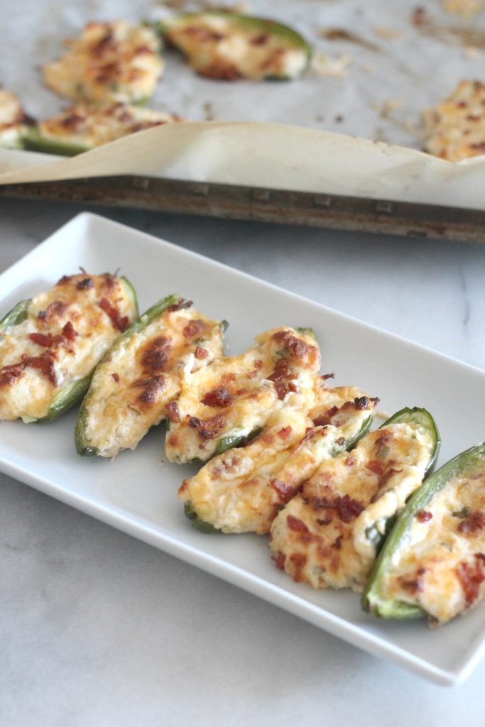 You are going to love this recipe for roasted chicken and bacon jalapeño poppers! These are perfect low carb/keto appetizers and they taste amazing. #lowcarbrecipes #chicken #jalapenopoppers #ketorecipes