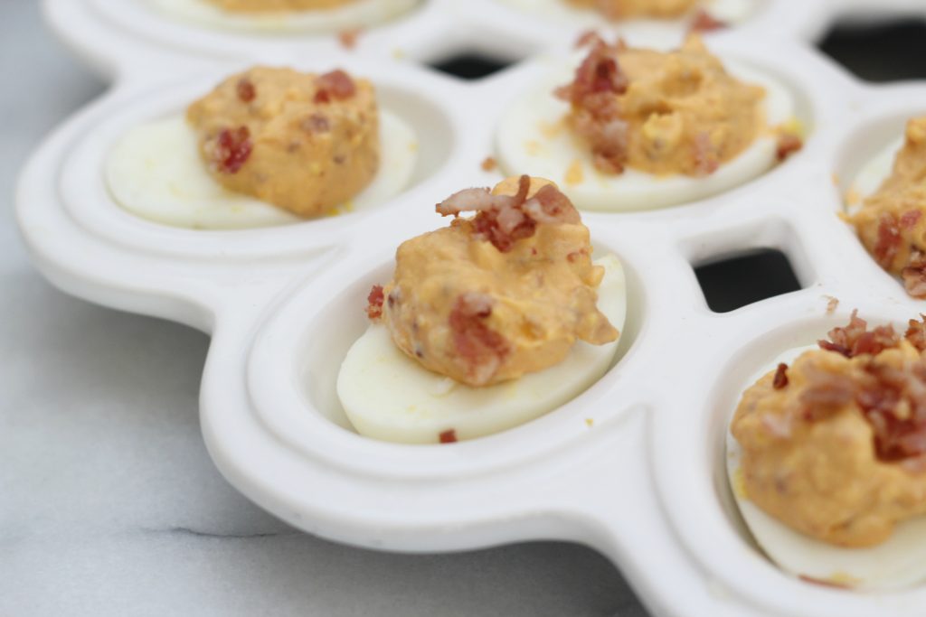 This is not your basic deviled egg recipe! These spicy bacon deviled eggs are so delicious and perfectly low carb!