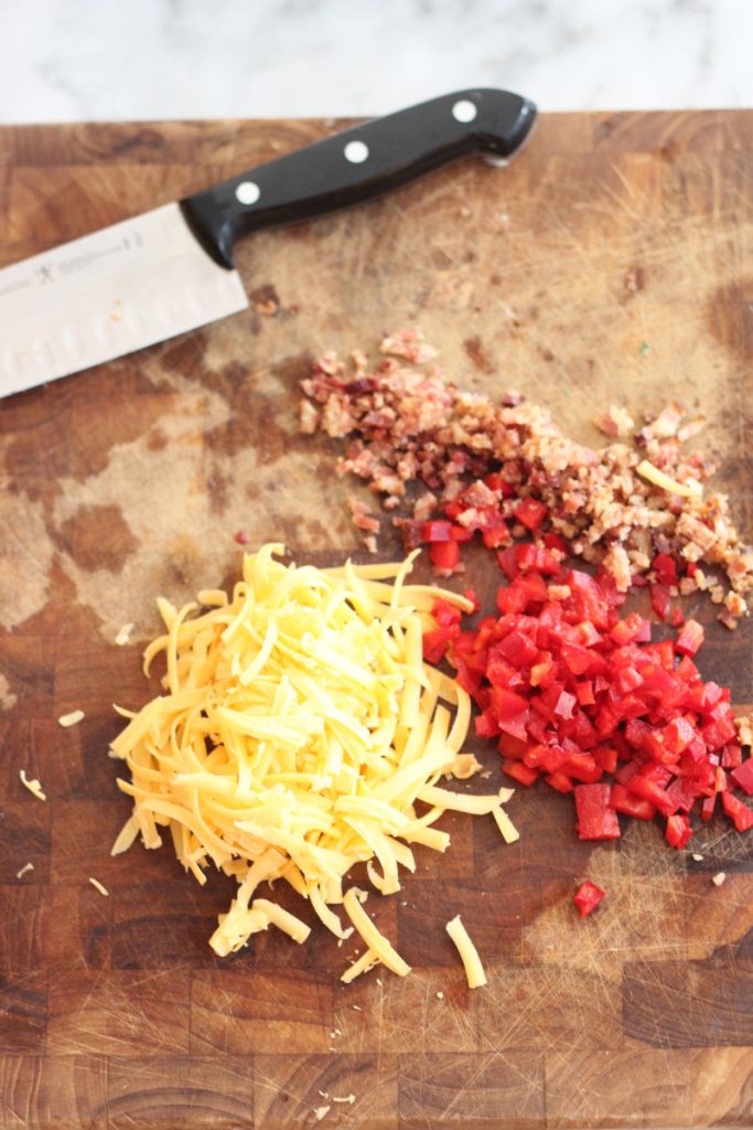 These keto bacon, bell pepper and cheddar eggs bites are great for breakfast or a post workout snack. Only one carb per egg bite!