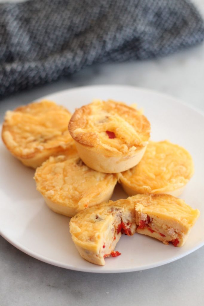 These keto bacon, bell pepper and cheddar eggs bites are great for breakfast or a post workout snack. Only one carb per egg bite!