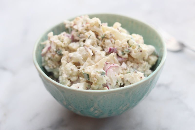 Swap lightly roasted cauliflower for the potatoes makes the base for this delicious keto cauliflower "potato" salad.
