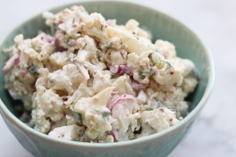 Swap lightly roasted cauliflower for the potatoes makes the base for this delicious keto cauliflower "potato" salad.