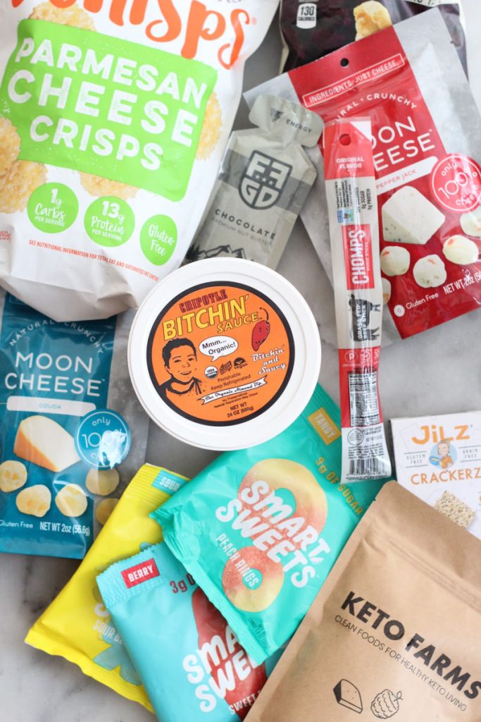 Best tasting keto snacks including whisps, moon cheese, chomps sticks, bitchin' sauce, smart sweets gummies. #lowcarbdelish #keto